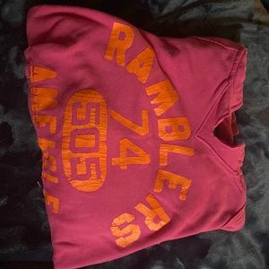 Soft pink hoodie with orange writing and from hollister